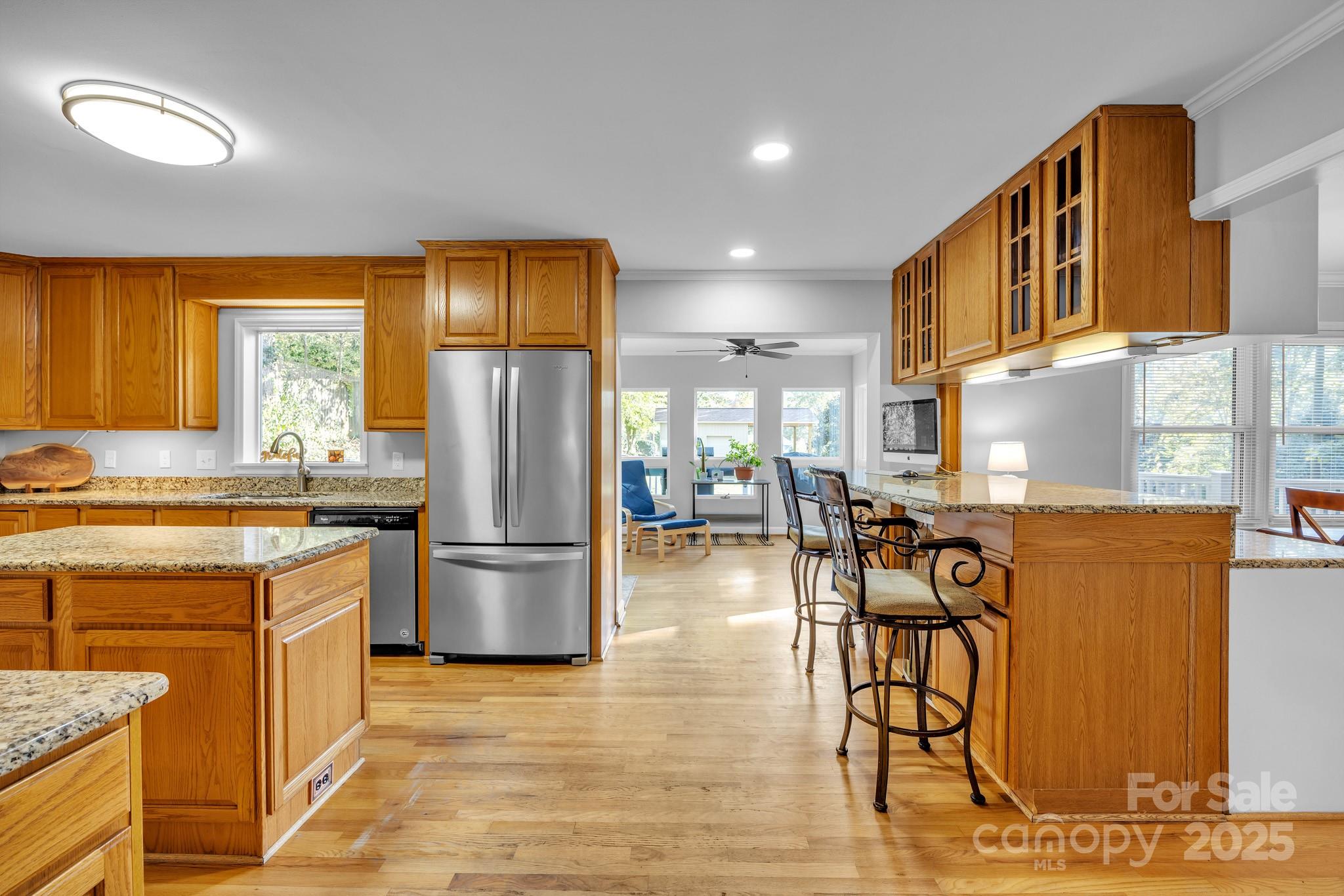 651 25th Avenue Northwest Hickory, NC 28601 - Photo 14 of 35 a kitchen with stainless steel appliances granite countertop a refrigerator and a stove top oven