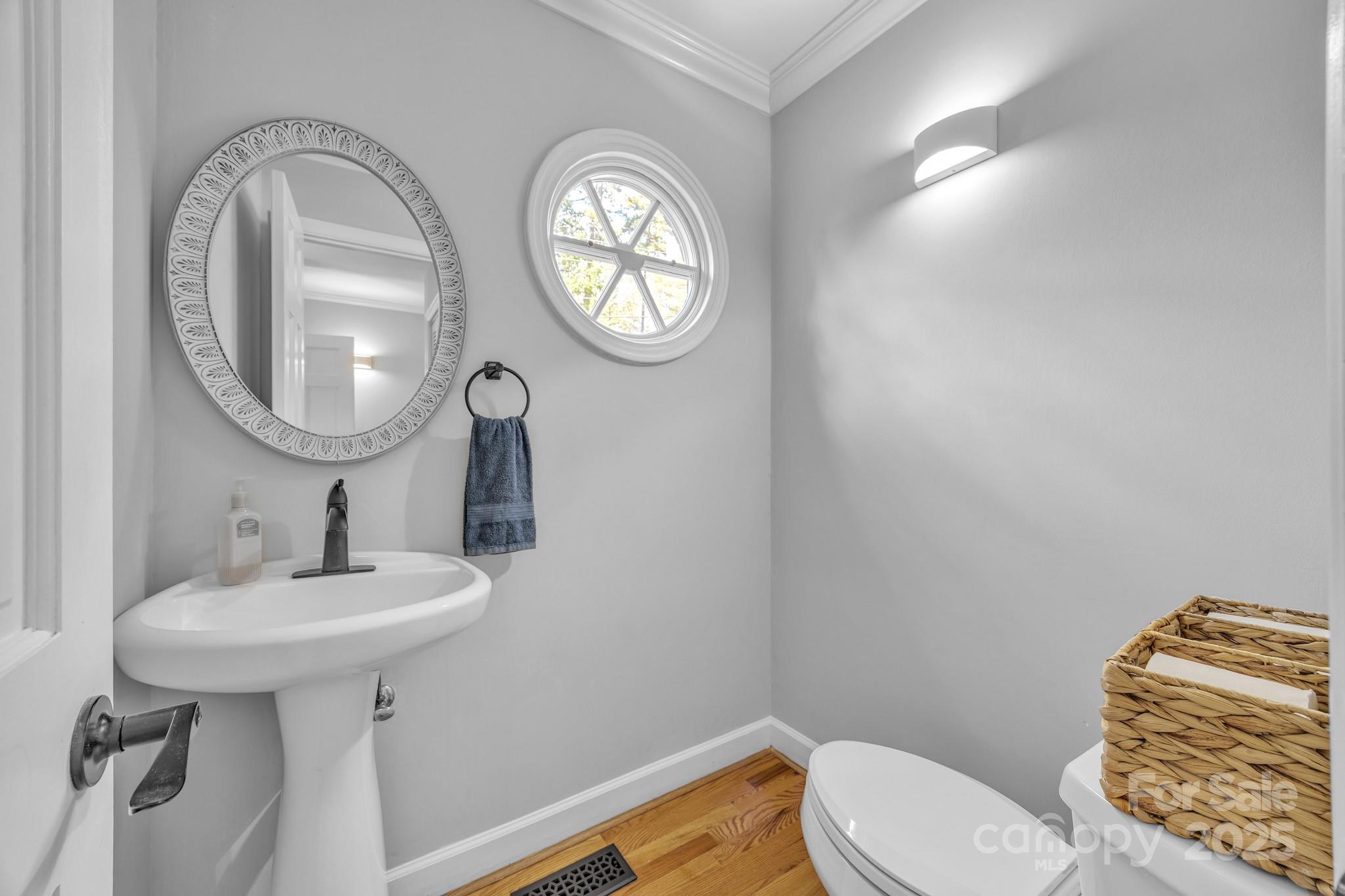 651 25th Avenue Northwest Hickory, NC 28601 - Photo 17 of 35 a bathroom with a toilet sink and mirror