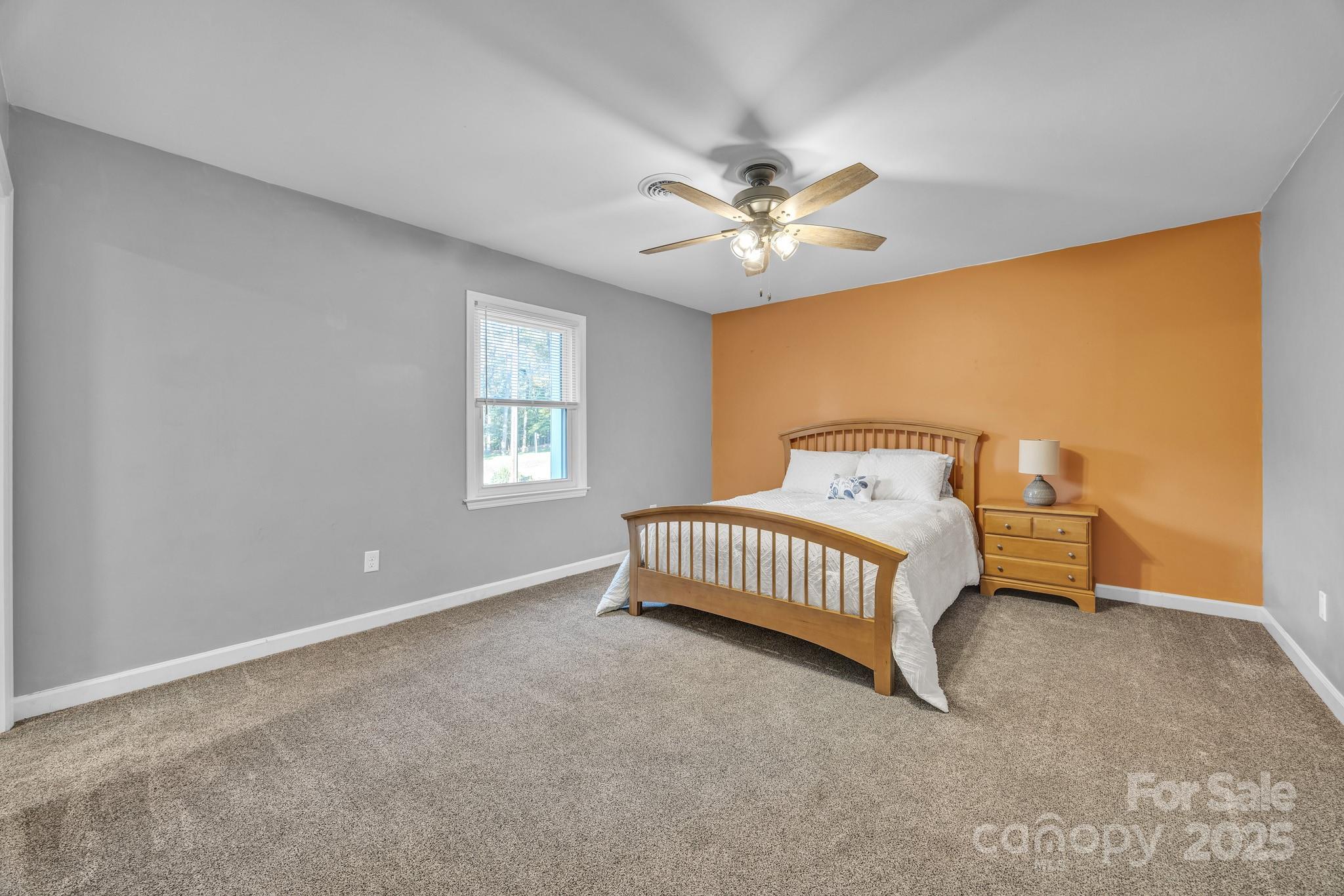 651 25th Avenue Northwest Hickory, NC 28601 - Photo 19 of 35 a bedroom with a bed and a ceiling fan