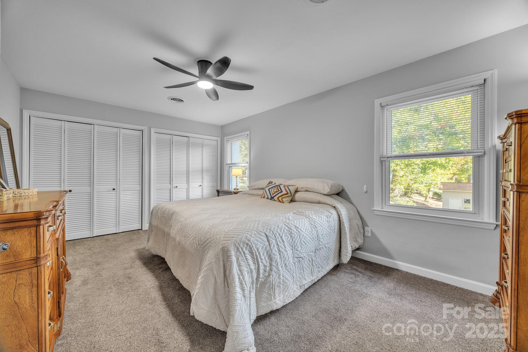 651 25th Avenue Northwest Hickory, NC 28601 - Photo 20 of 35 a spacious bedroom with a bed and a window