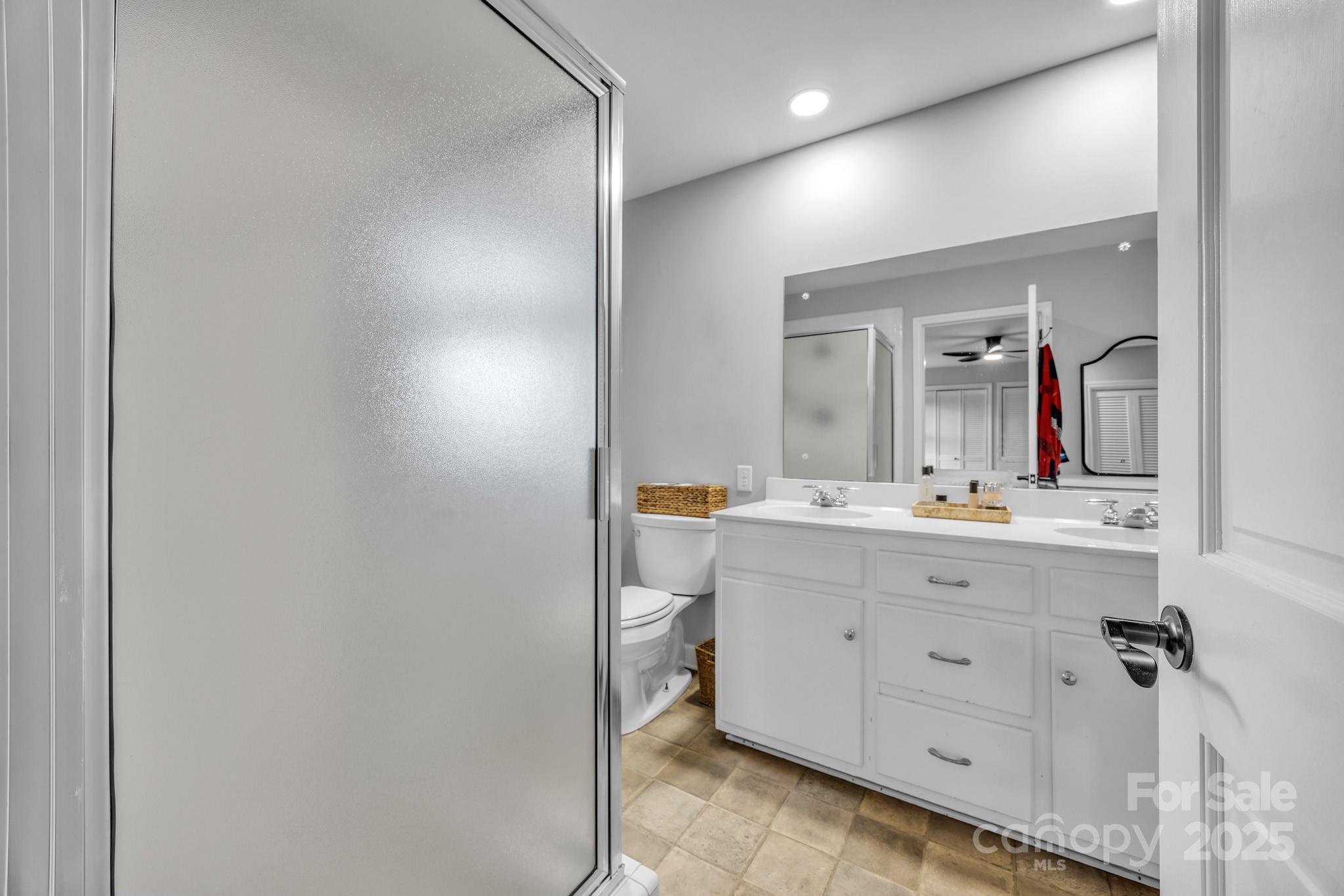 651 25th Avenue Northwest Hickory, NC 28601 - Photo 21 of 35 a bathroom with a double vanity sink and mirror