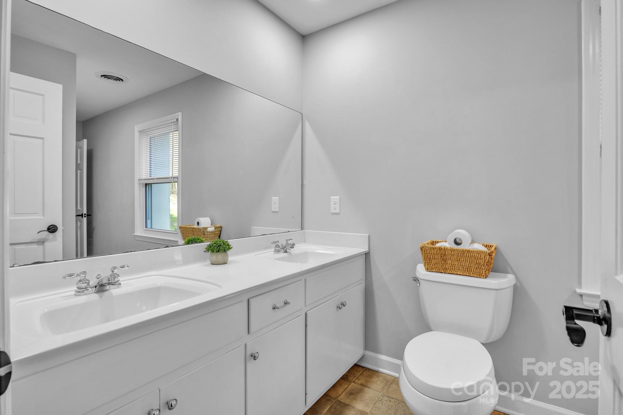 651 25th Avenue Northwest Hickory, NC 28601 - Photo 24 of 35 a bathroom with a toilet sink vanity granite and mirror