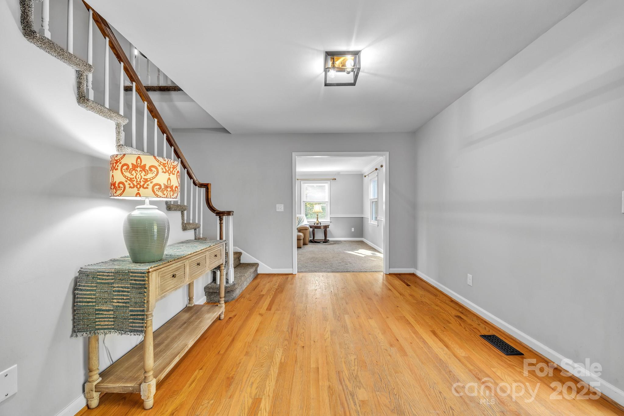 651 25th Avenue Northwest Hickory, NC 28601 - Photo 6 of 35 a view of a bedroom with wooden floor and staircase