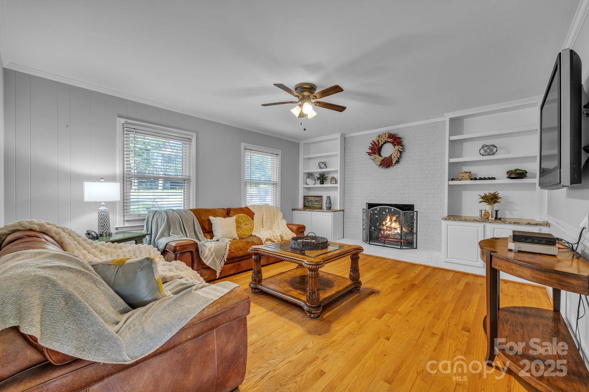 651 25th Avenue Northwest Hickory, NC 28601 - Photo 7 of 35 a living room with furniture and a fireplace