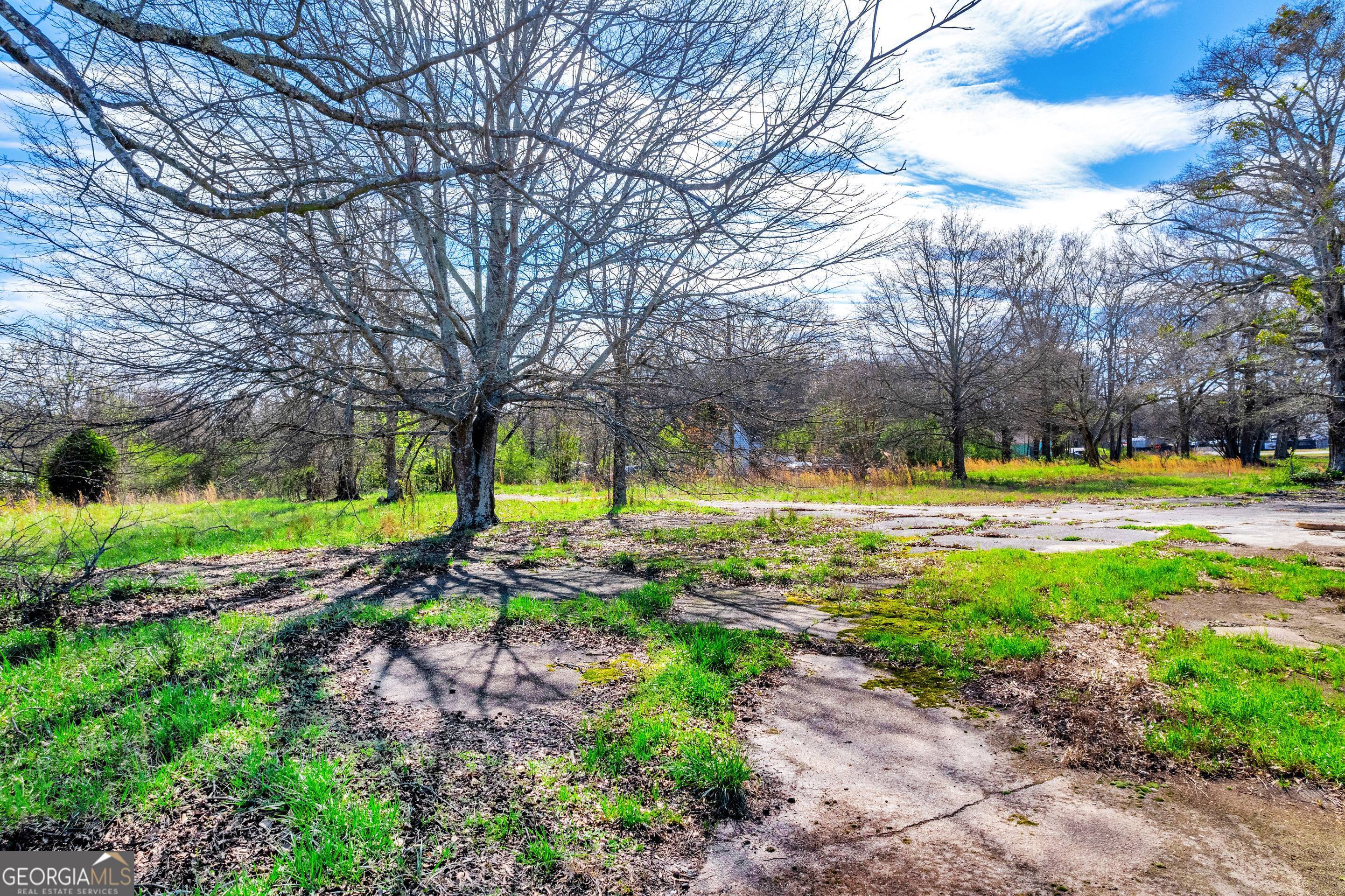 526 Madison Street Commerce, GA 30529 - Photo 20 of 23 a view of yard with swimming pool and green space