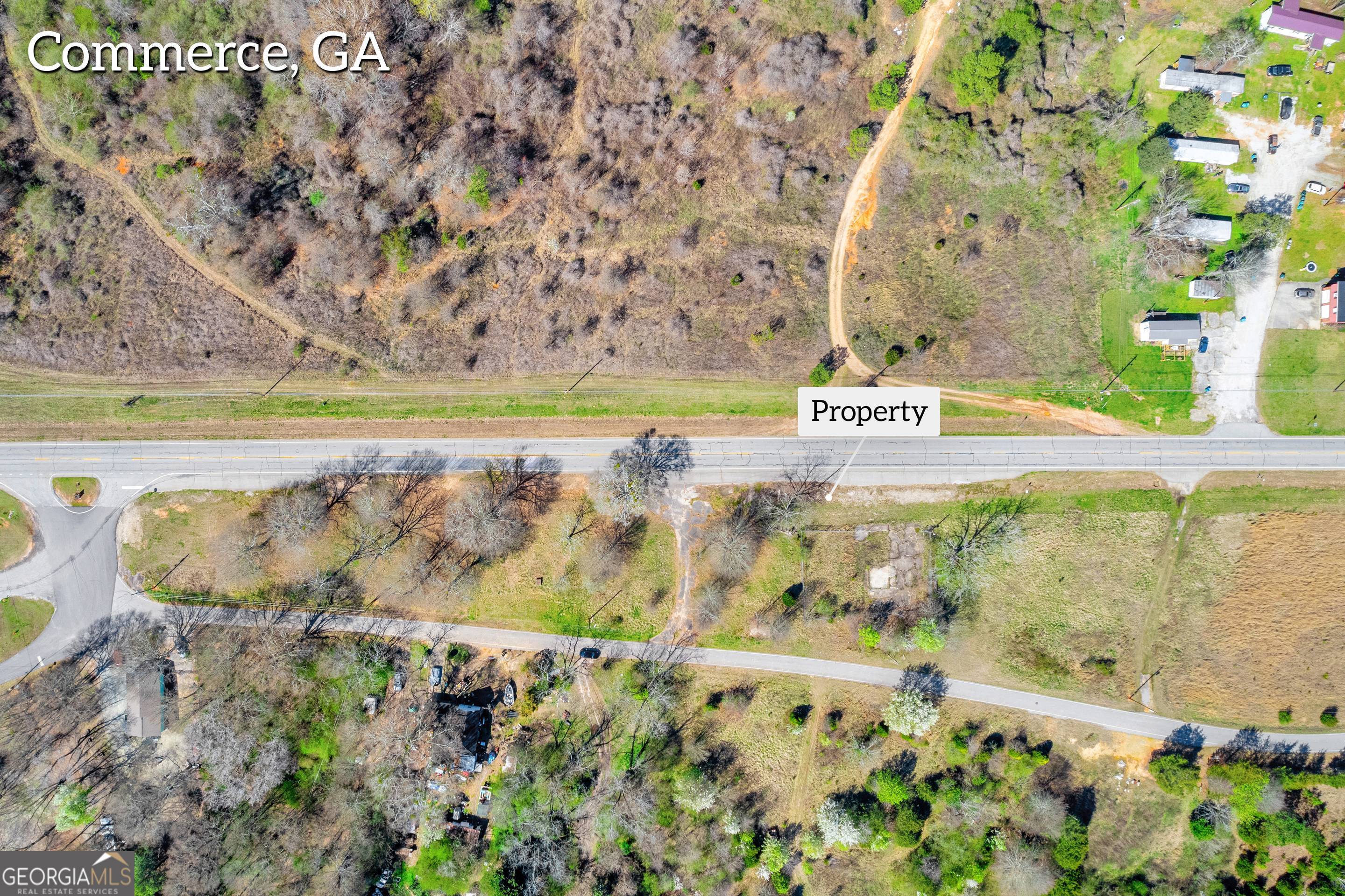 526 Madison Street Commerce, GA 30529 - Photo 4 of 23 a view of swimming pool with a yard