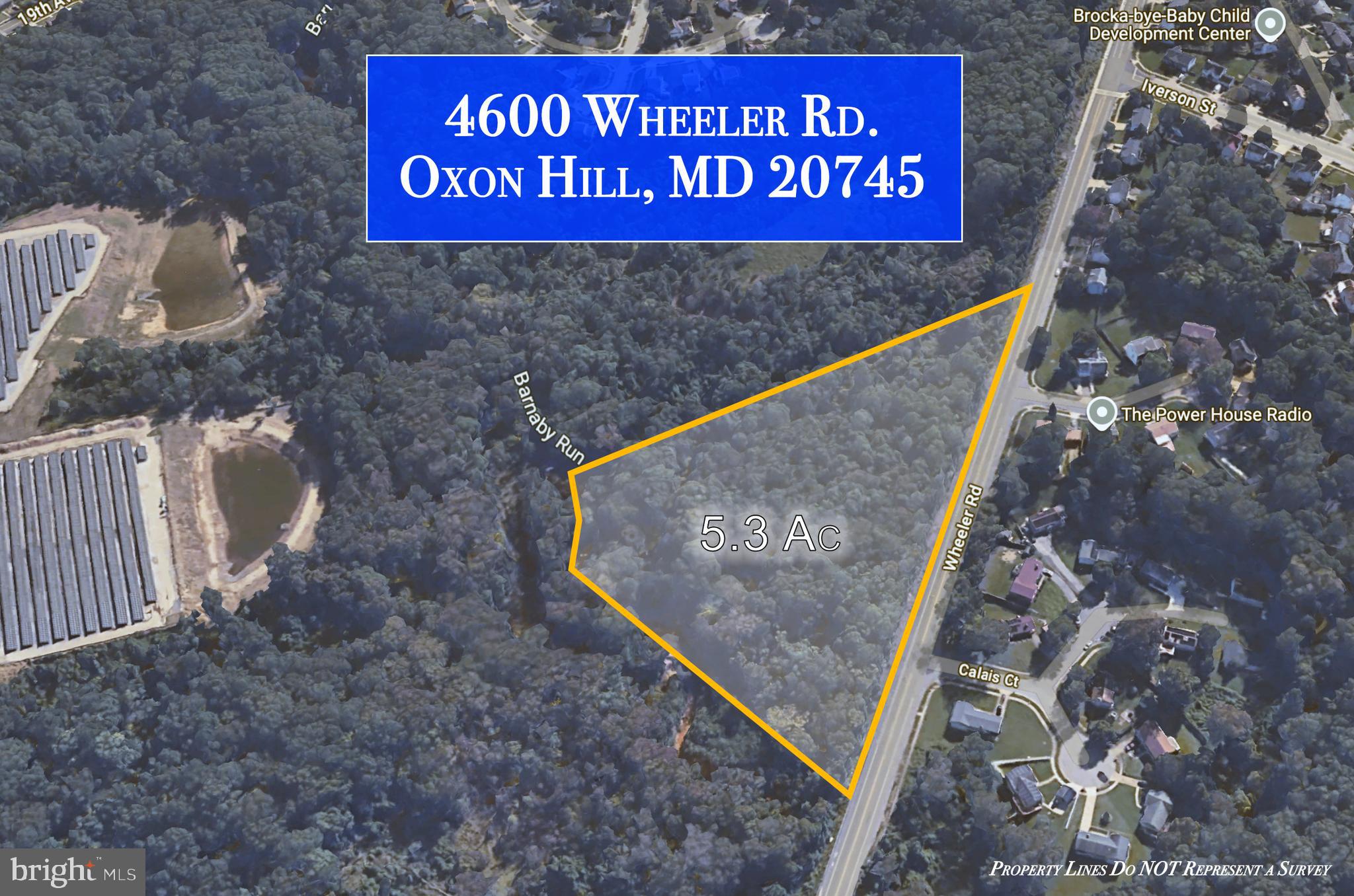 4600 Wheeler Road Oxon Hill, MD 20745 - Photo 5 of 9 a sign that is on a brick wall