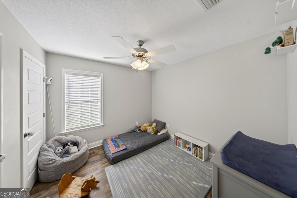 15 Ruger Circle Lakeland, GA 31635 - Photo 27 of 31 a bedroom with a bed and a couch