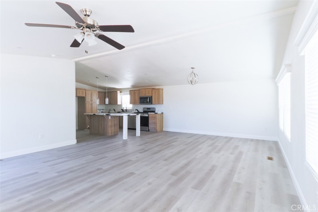 40104 Walcott Lane Temecula, CA 92591 - Photo 11 of 41 a view of a kitchen with a sink wooden floor and a window