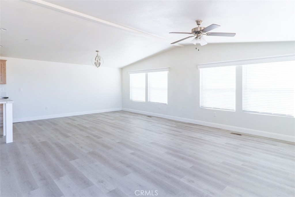 40104 Walcott Lane Temecula, CA 92591 - Photo 13 of 41 an empty room with wooden floor fan and windows