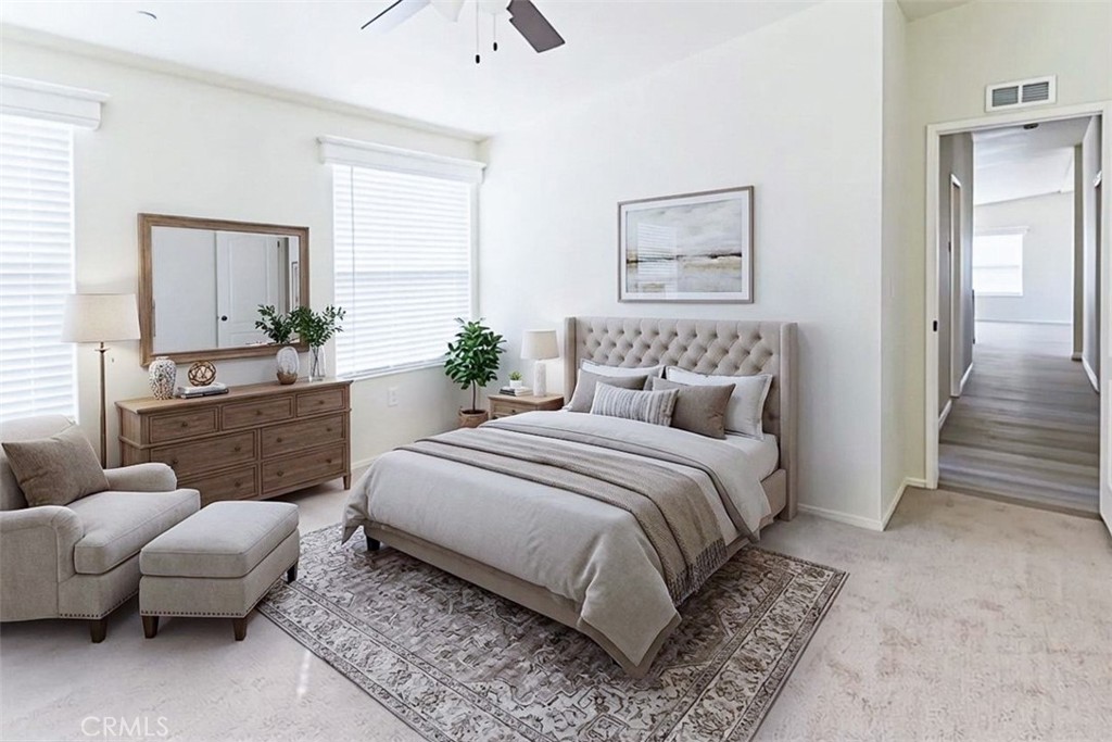 40104 Walcott Lane Temecula, CA 92591 - Photo 28 of 41 a bedroom with a bed and glass window