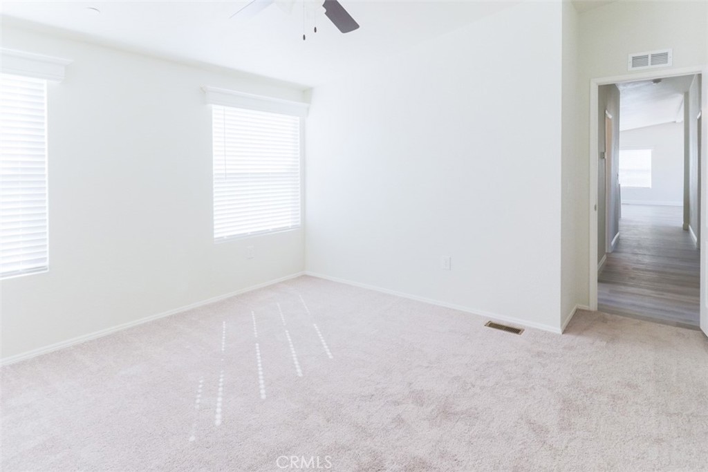 40104 Walcott Lane Temecula, CA 92591 - Photo 29 of 41 an empty room with windows and closet