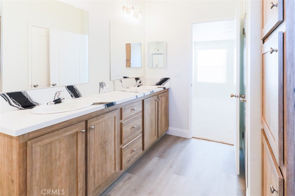 40104 Walcott Lane Temecula, CA 92591 - Photo 32 of 41 a kitchen with a sink and a refrigerator