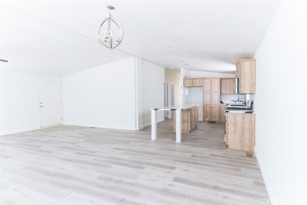 40104 Walcott Lane Temecula, CA 92591 - Photo 9 of 41 a view of kitchen with furniture and wooden floor