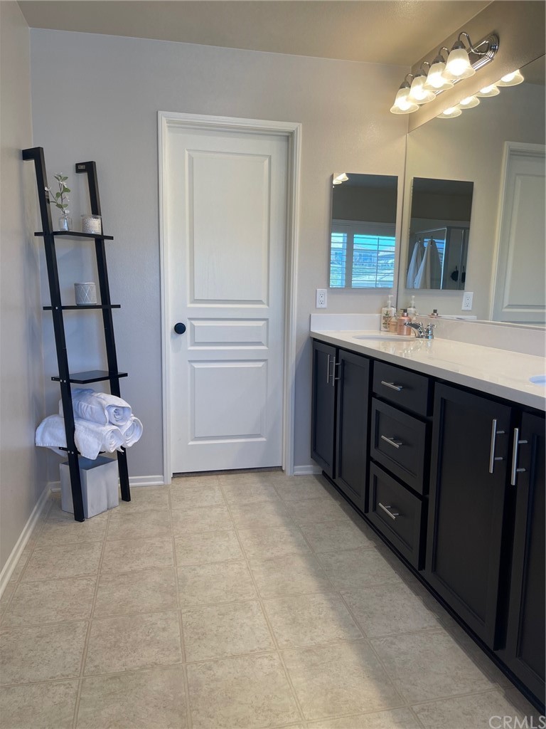 35334 Thorpe Trail Beaumont, CA 92223 - Photo 45 of 74 a bathroom with a sink a toilet and mirror