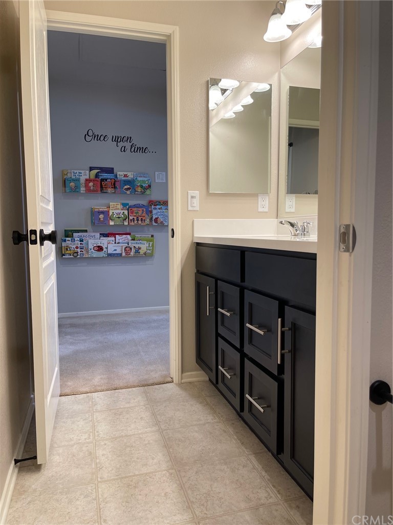 35334 Thorpe Trail Beaumont, CA 92223 - Photo 50 of 74 a bathroom with a sink and a mirror