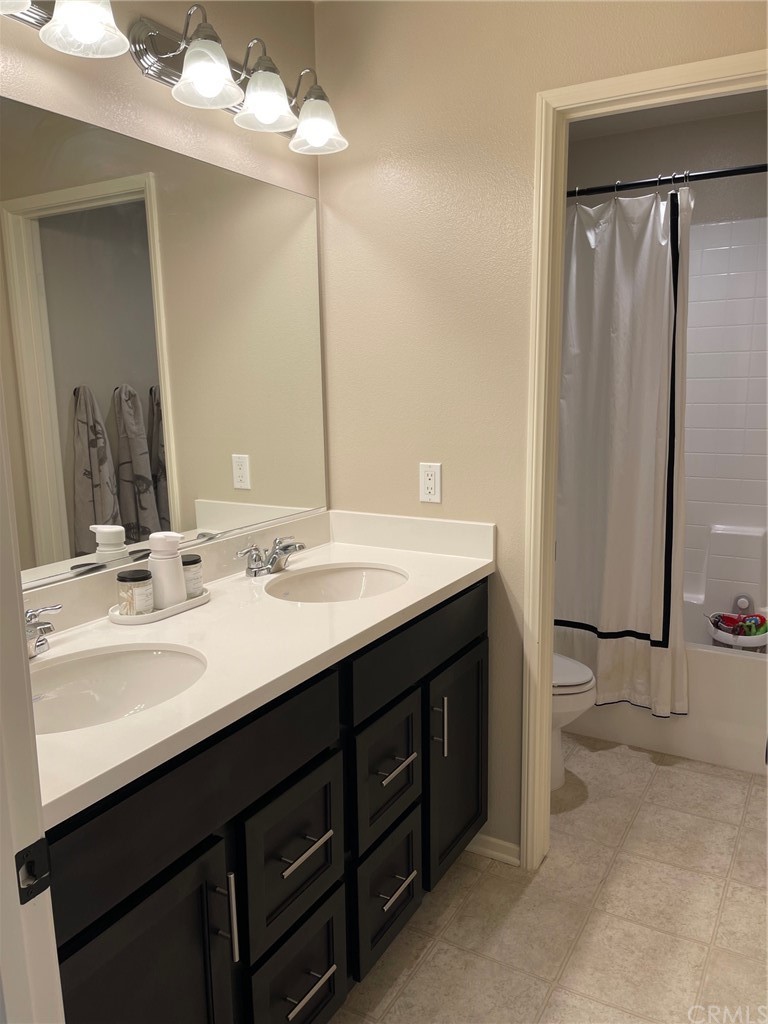 35334 Thorpe Trail Beaumont, CA 92223 - Photo 51 of 74 a bathroom with a double vanity sink mirror and double