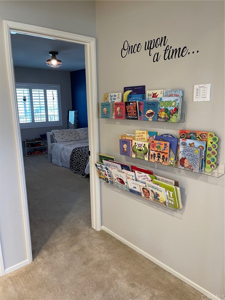 35334 Thorpe Trail Beaumont, CA 92223 - Photo 53 of 74 a utility room with toys and wooden floor