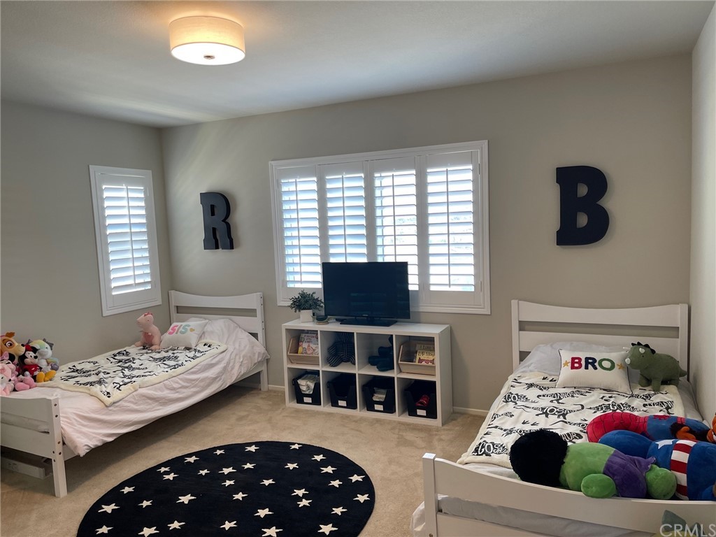 35334 Thorpe Trail Beaumont, CA 92223 - Photo 56 of 74 a bedroom with a bed and a window