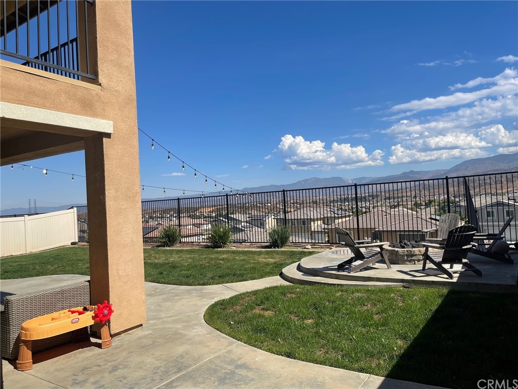 35334 Thorpe Trail Beaumont, CA 92223 - Photo 64 of 74 a view of a patio with table and chairs and potted plants