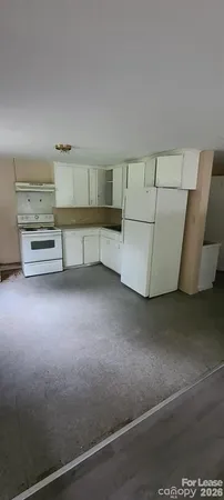 a view of room with furniture and cabinet