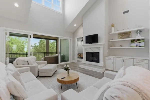 a living room with furniture and a fireplace