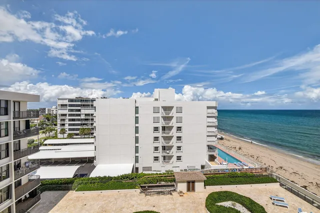 a hallway with sliding door and furniture