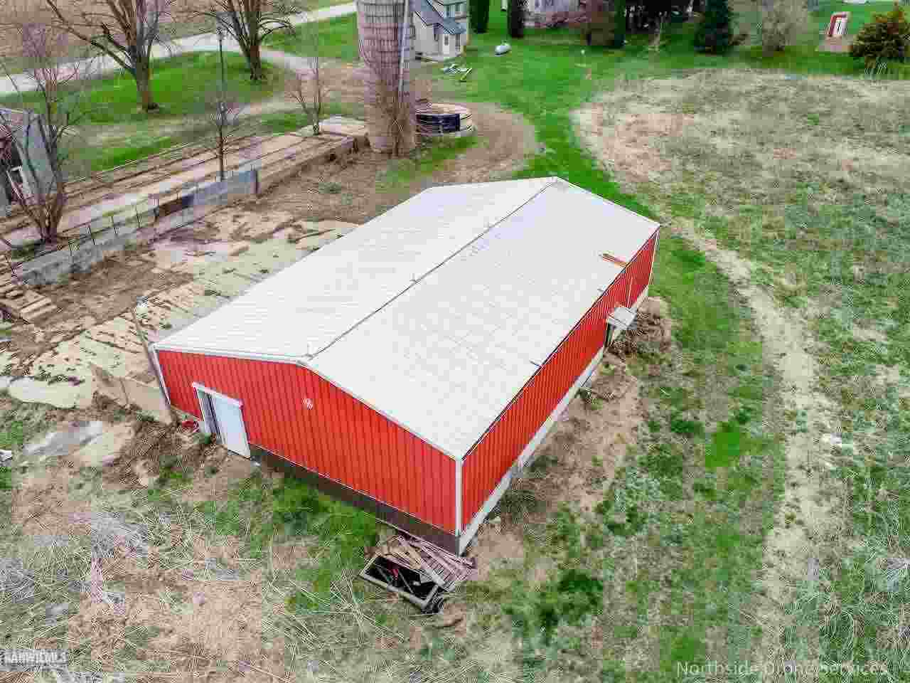 15456 West Nora Road Winslow, IL 61089 - Photo 12 of 14 a view of a backyard with a barn