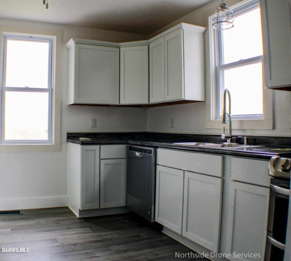 15456 West Nora Road Winslow, IL 61089 - Photo 4 of 14 a kitchen with a sink cabinets and window