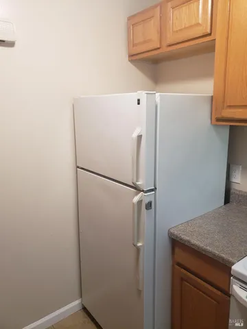 a stove top oven sitting inside of a kitchen