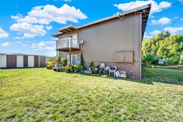 a view of a house with a big yard