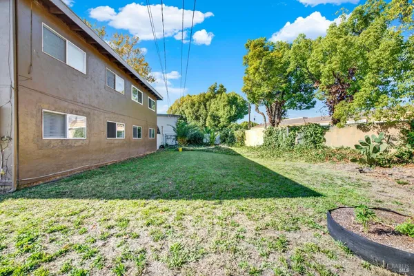 a view of a house with a back yard