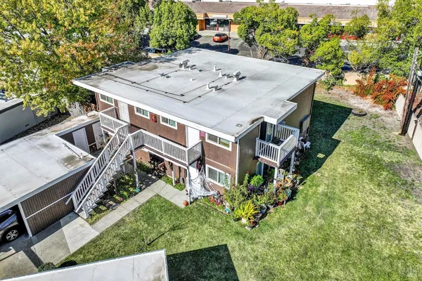 an aerial view of a house with an outdoor space
