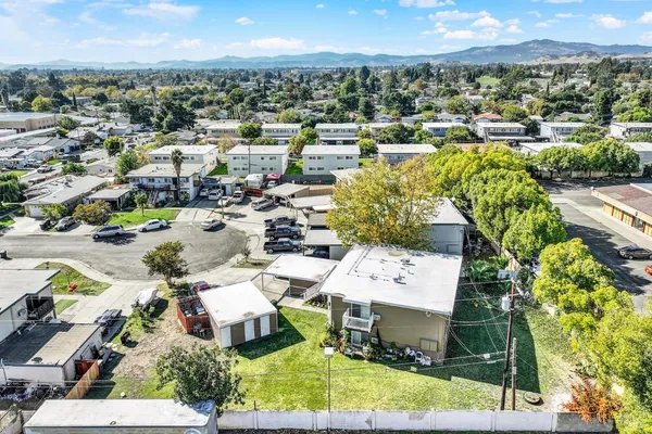 a view of a balcony with wooden floor and iron stairs
