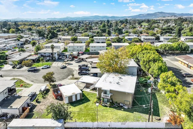 a view of a balcony with wooden floor and iron stairs