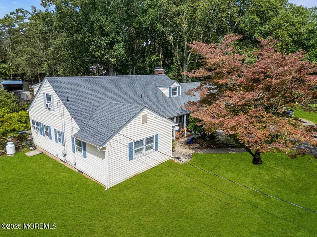 an aerial view of house with yard