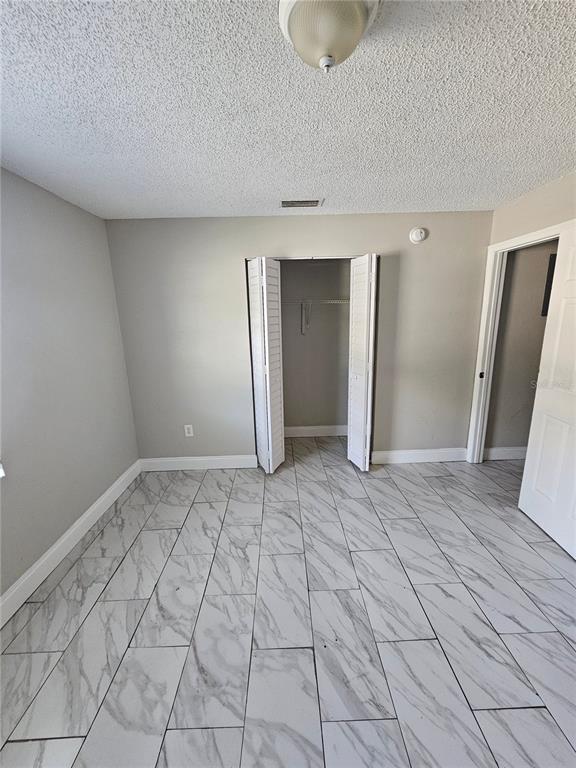 1013 Beecher Street, Unit 1 Leesburg, FL 34748 - Photo 5 of 12 a view of an empty room