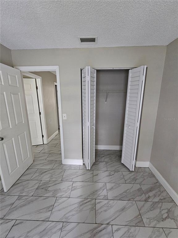 1013 Beecher Street, Unit 1 Leesburg, FL 34748 - Photo 10 of 12 an empty room with a space