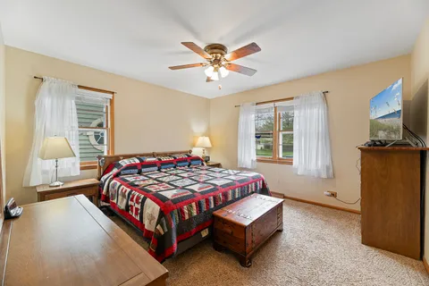a bedroom with a bed and window