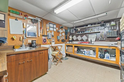 a utility room with stainless steel appliances a stove and a window