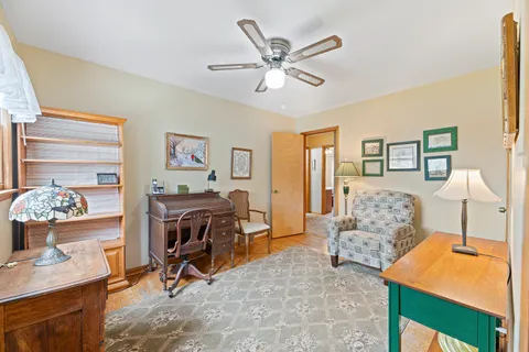 a view of a livingroom with furniture and a workspace