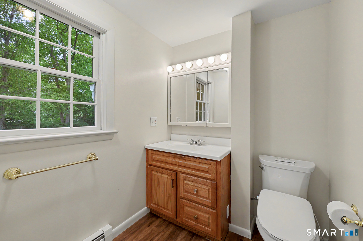 19 Geneva Road Norwalk, CT 06850 - Photo 17 of 33 a bathroom with a toilet a sink and a window
