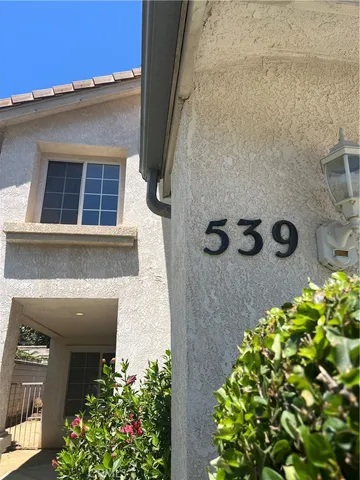 view of a house with a potted plant