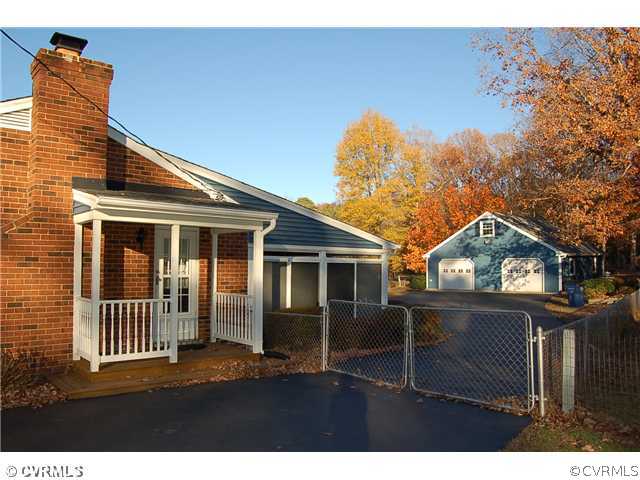 8100 Winterpock Road Chesterfield, VA 23832 - Photo 17 of 21 a front view of a house with a garden