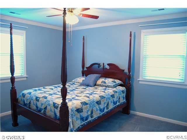 8100 Winterpock Road Chesterfield, VA 23832 - Photo 5 of 21 a bedroom with a bed and a window