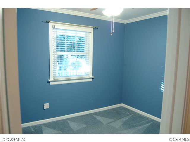 8100 Winterpock Road Chesterfield, VA 23832 - Photo 6 of 21 a view of an empty room with a window