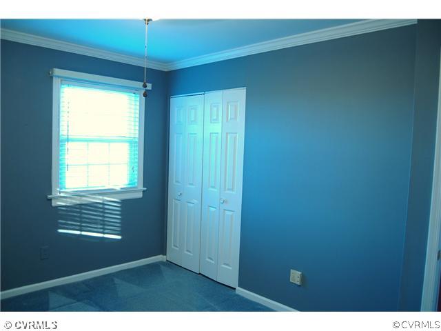 8100 Winterpock Road Chesterfield, VA 23832 - Photo 7 of 21 a view of an empty room with a window