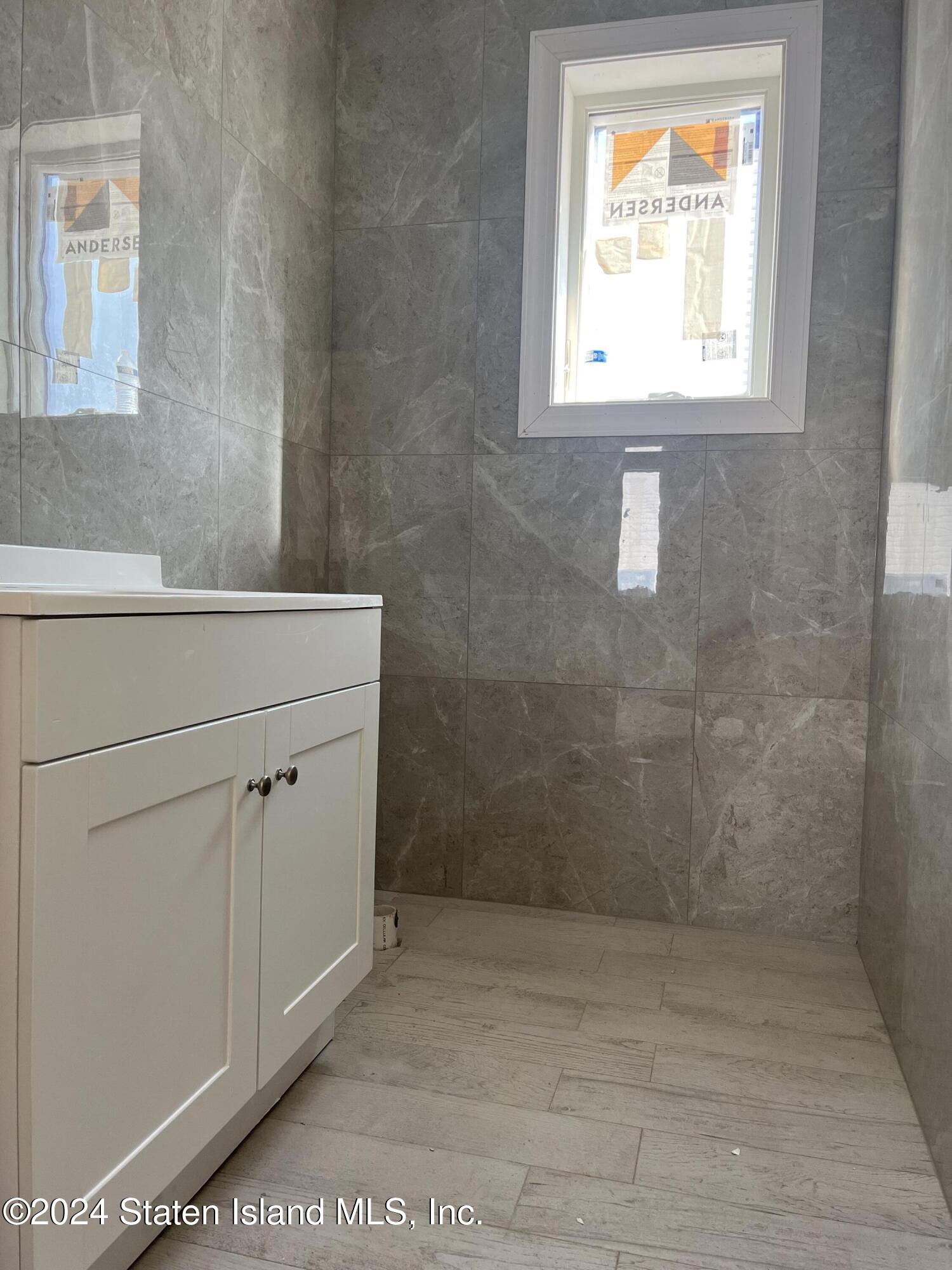 3474 Richmond Road Staten Island, NY 10306 - Photo 5 of 9 a bathroom with a window