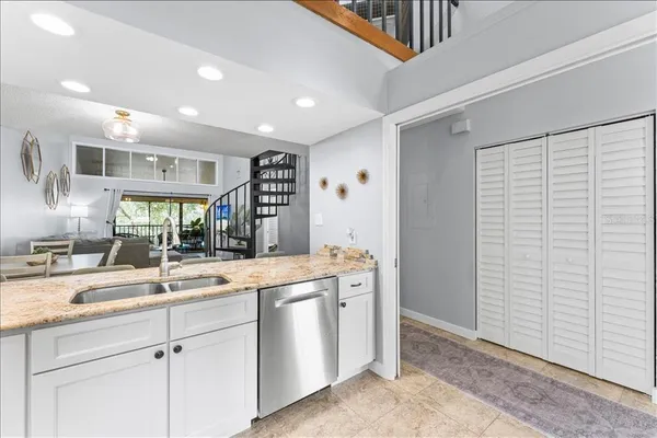 a kitchen with a sink and a refrigerator