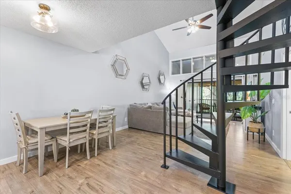 a view of a dining room with furniture window and wooden floor